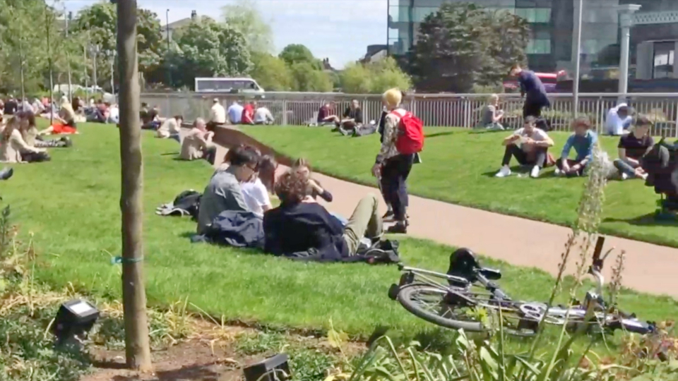 London Girls and boyfriends sitting at park knoll in the city